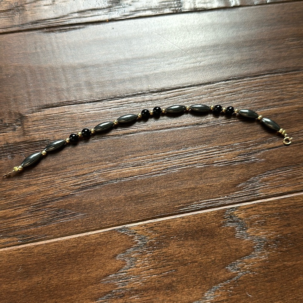 Black, grey and gold beaded bracelet